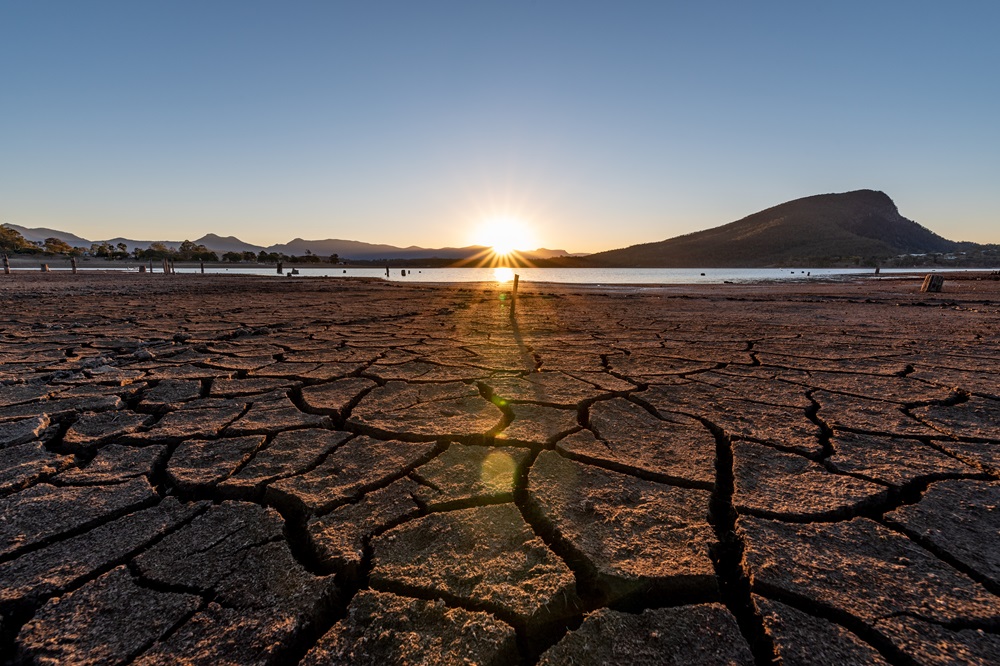 Drought-stricken land with a sunset
