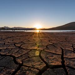 Drought-stricken land with a sunset